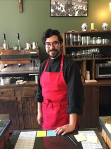 Br. Alfredo at the coffee shop waiting to take your order
