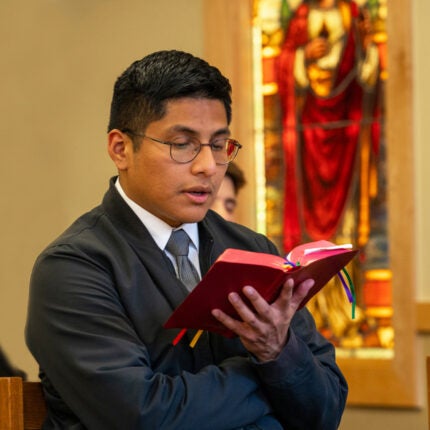 A seminarian prays vespers in the Blessed Sacrament chapel of Anselm Hall at Mount Angel Seminary.