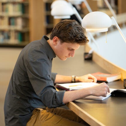 A seminarian in the Discipleship stage studies in Mount Angel's Aalto library.