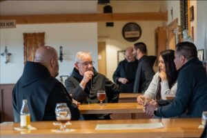 Abbot Jeremy and Br. Ignatius speaking with oblates