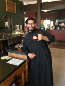 Fr Israel back from Rome enjoying a coffee