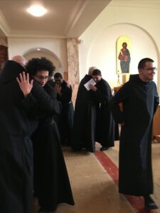 Monks welcoming new postulants after the Rite of Reception