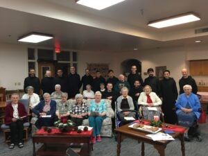 Monks with the Benedictine sisters at Queen of Angels. It is an annual tradition for us to sing Christmas carols together