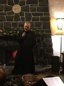 Novice Br. Andrew introducing his performance, which was a monastic parody on the 12 Days of Christmas